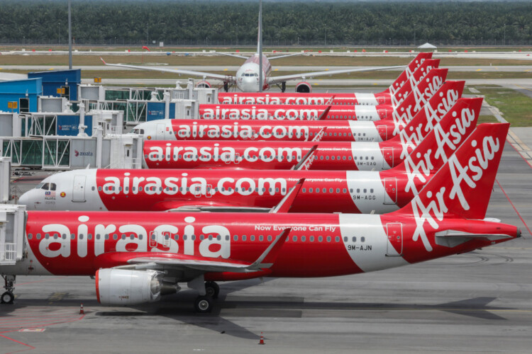 AirAsia planes are seen parked at Kuala Lumpur International Airport 2, during the movement control order due to the outbreak of the coronavirus disease (COVID-19), in Sepang, Malaysia April 14, 2020. REUTERS/Lim Huey Teng